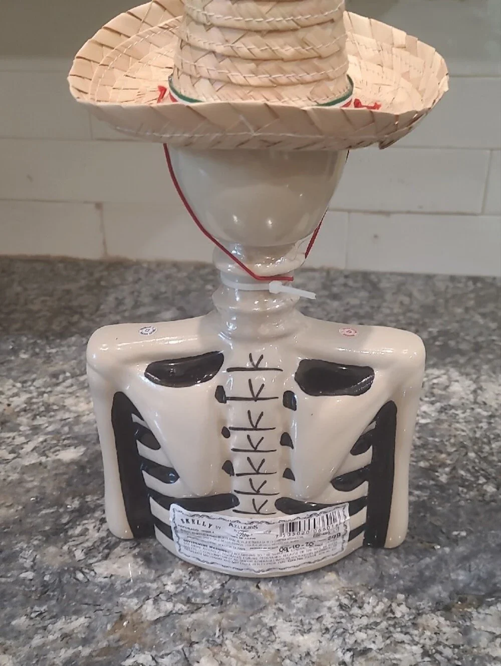 Ceramic Skeleton Bust Décor in White and Black with Straw Hat Accent